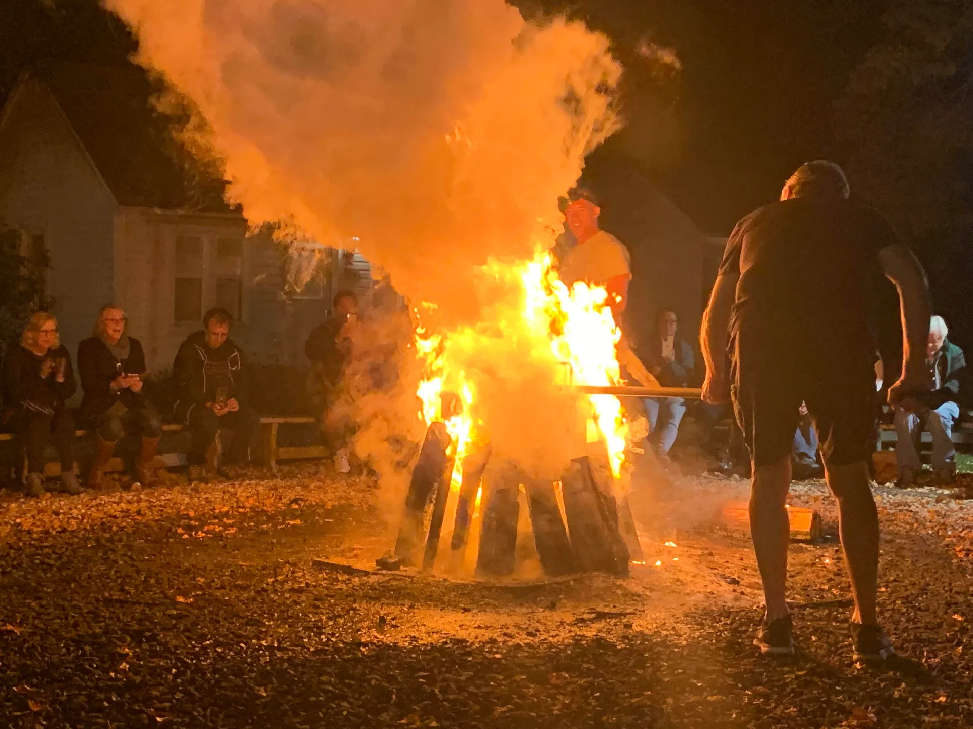 Flames and steam as visitors enjoy a Door County Fish Boil